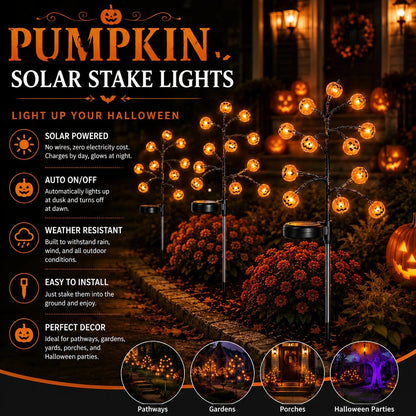 Glowing pumpkin solar stake tree lights with orange jack-o’-lantern bulbs on branches