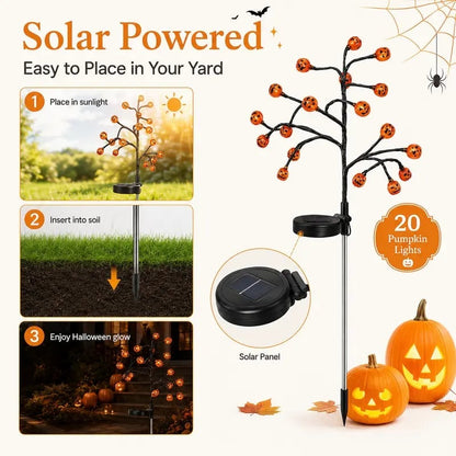 Solar powered pumpkin stake tree lights with glowing pumpkin heads and solar panel base