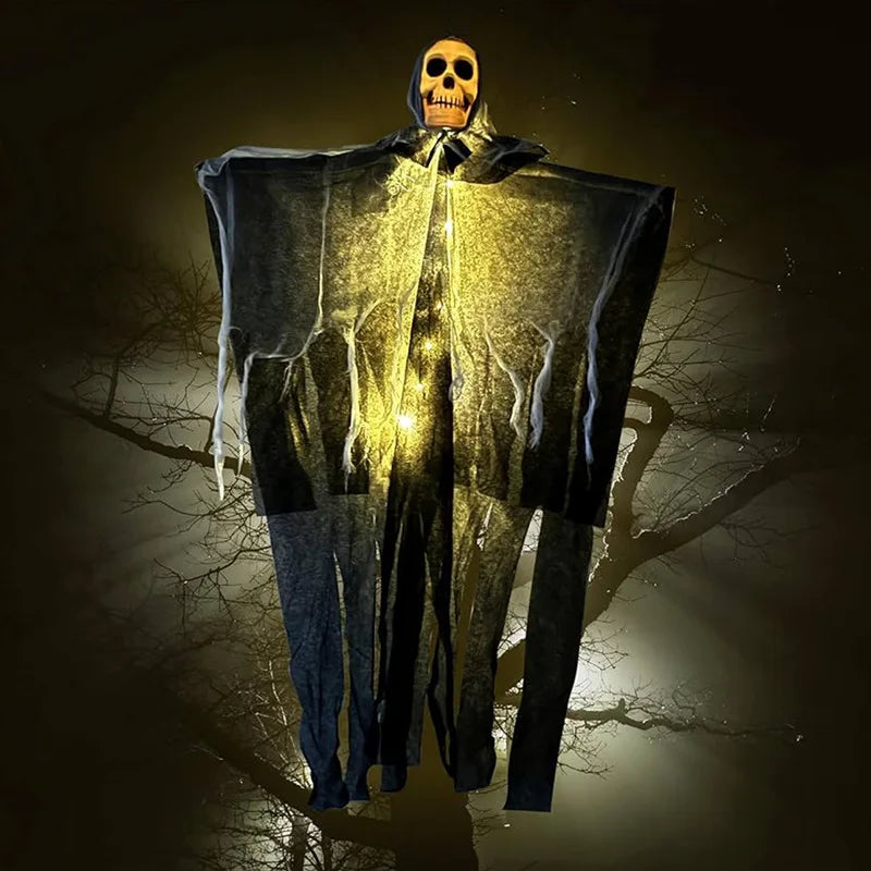 Glowing skeleton gauze hanging ghost decoration with warm-lit skull and hood