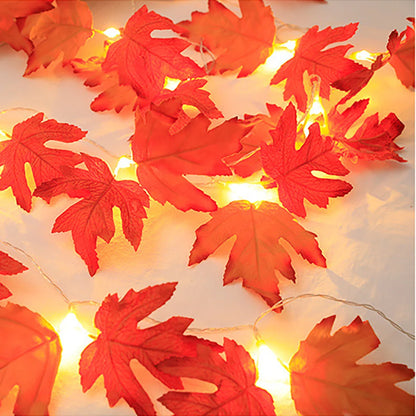 LED maple leaf lantern garland with red and orange maple-shaped lantern leaves glowing