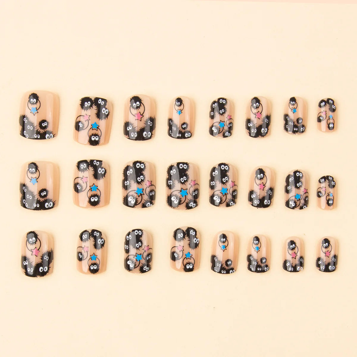Set of square short press-on nails with black cartoon critters and colorful stars