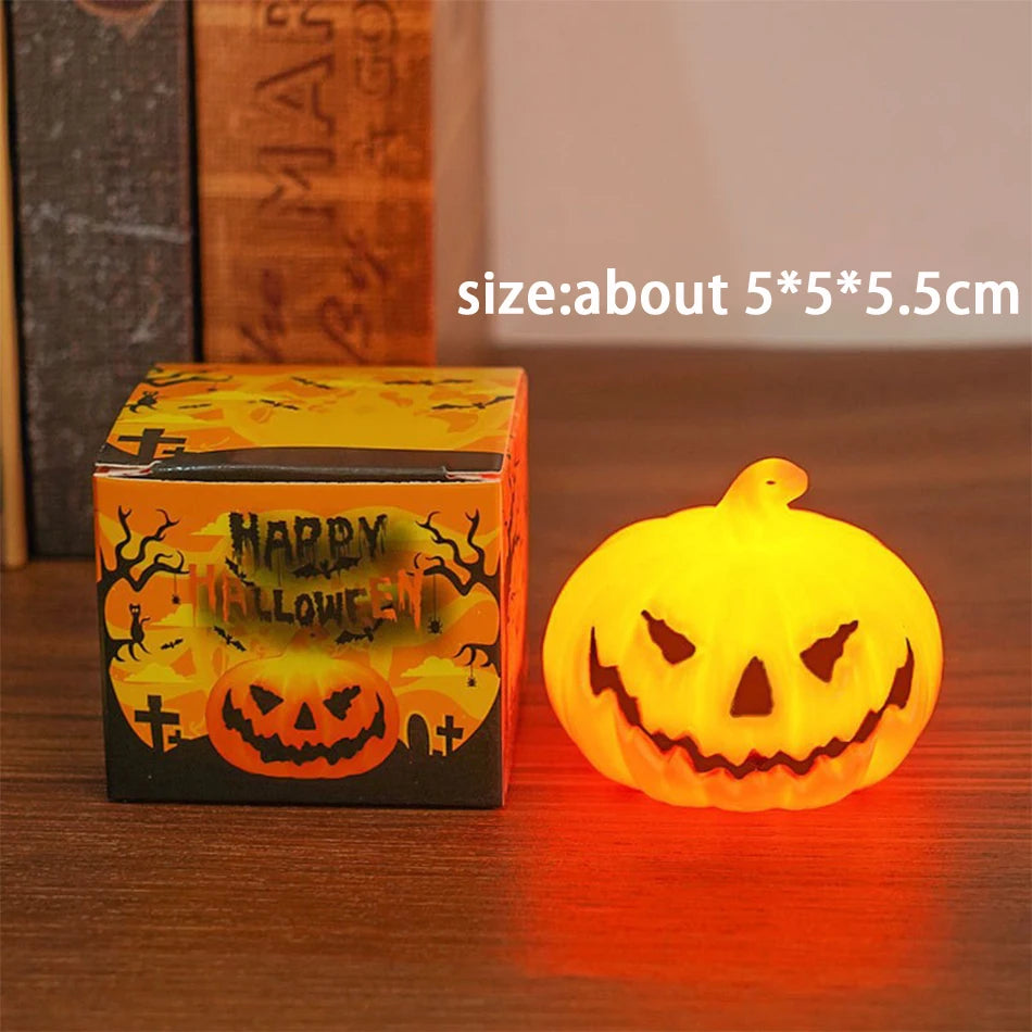 Single glowing orange LED pumpkin candle light with jack-o’-lantern carved face
