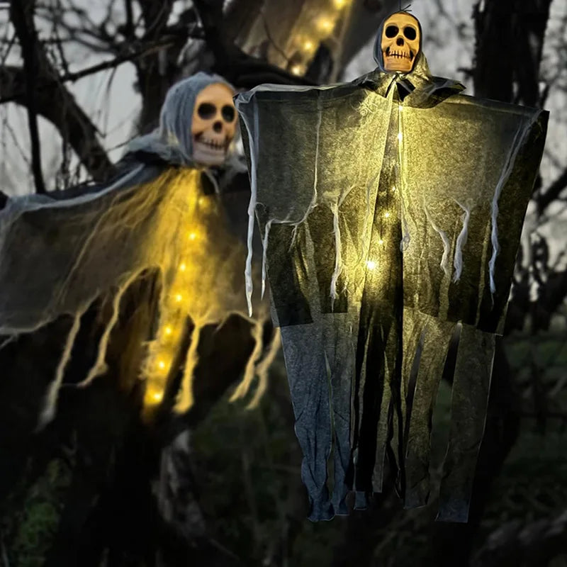 Glowing hanging skeleton gauze ghost with illuminated skull and flowing drape