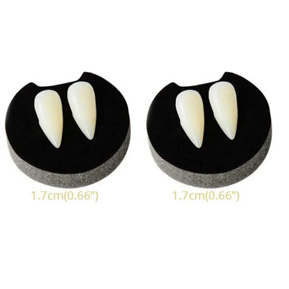 Vampire fang dentures with two ivory pointed teeth on black gum pieces, pair shown