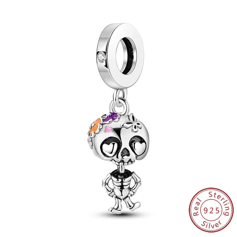925 sterling silver skull charm bead with orange enamel accents and hanging loop