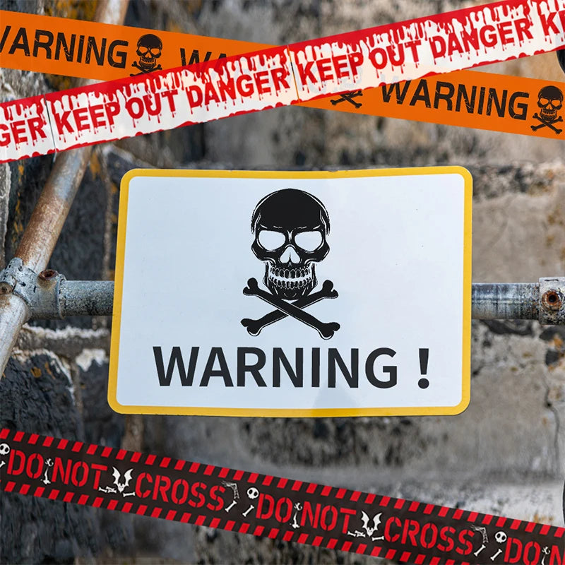 Halloween warning tape, black with red "DO NOT CROSS" and skull print near a "WARNING" sign
