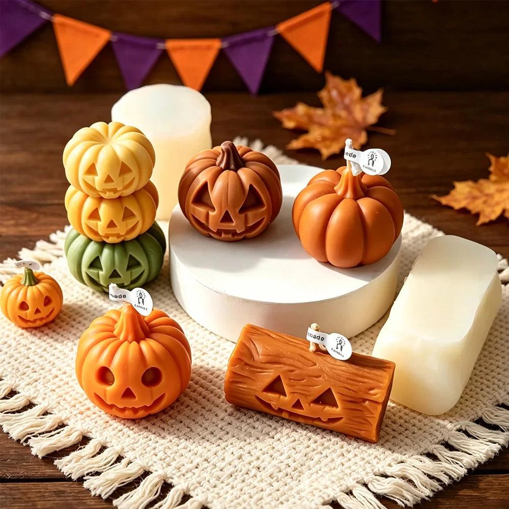 Ghost and pumpkin candle figures on a tray in white, orange, brown, and green