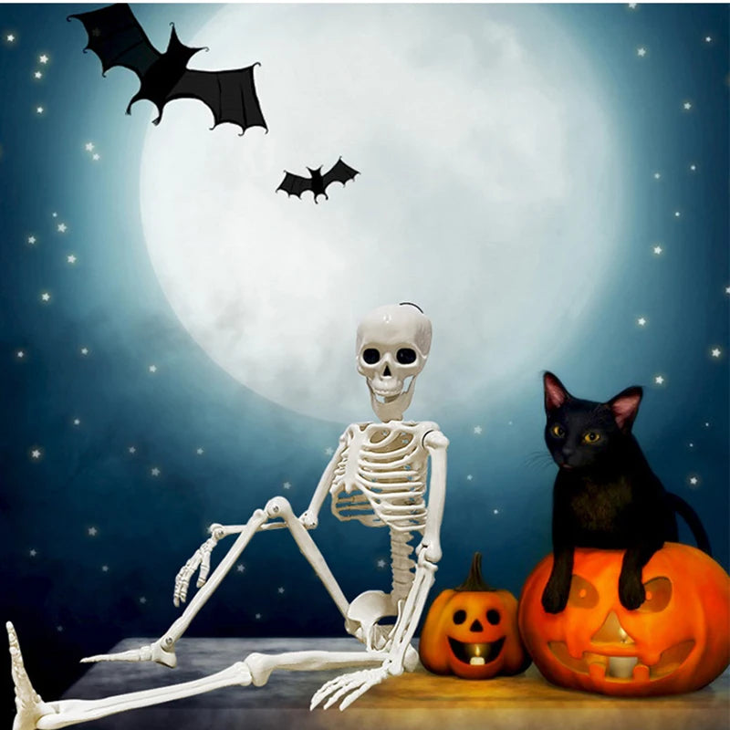 White skeleton prop with raised arm, skull face, Halloween graveyard decoration