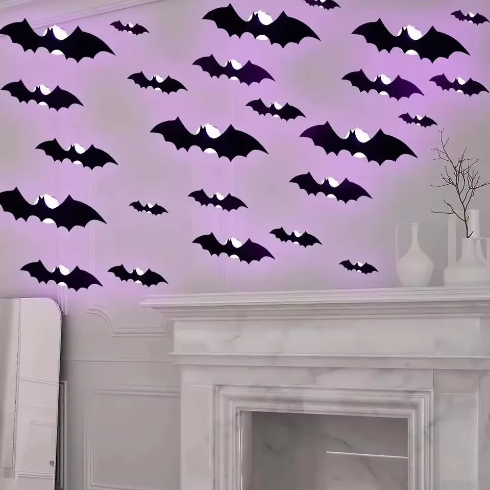 Black bat wall decals with subtle LED glow, on light wall
