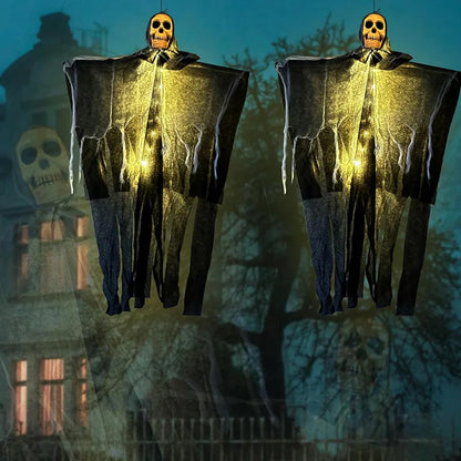Pair of glowing skeleton gauze hanging ghosts with warm-lit skull faces