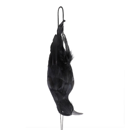 Black hanging crow prop side view with pointed beak and layered feathers