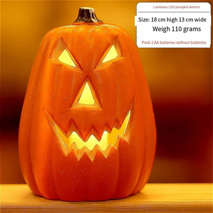 Orange LED pumpkin lantern with carved jack-o'-lantern face, warm light glowing