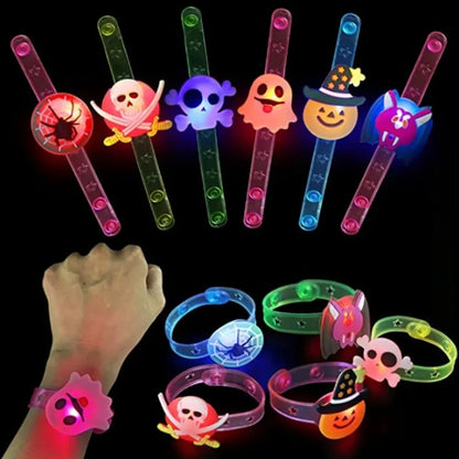 Glow-in-the-dark Halloween bracelets and rings in assorted colors with skull and ghost faces
