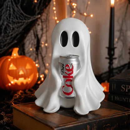 White ghost resin statue holding a silver soda can with red label, on a desk.