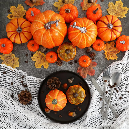 Artificial pumpkin decor set: orange faux pumpkins with brown stems on a dark plate.