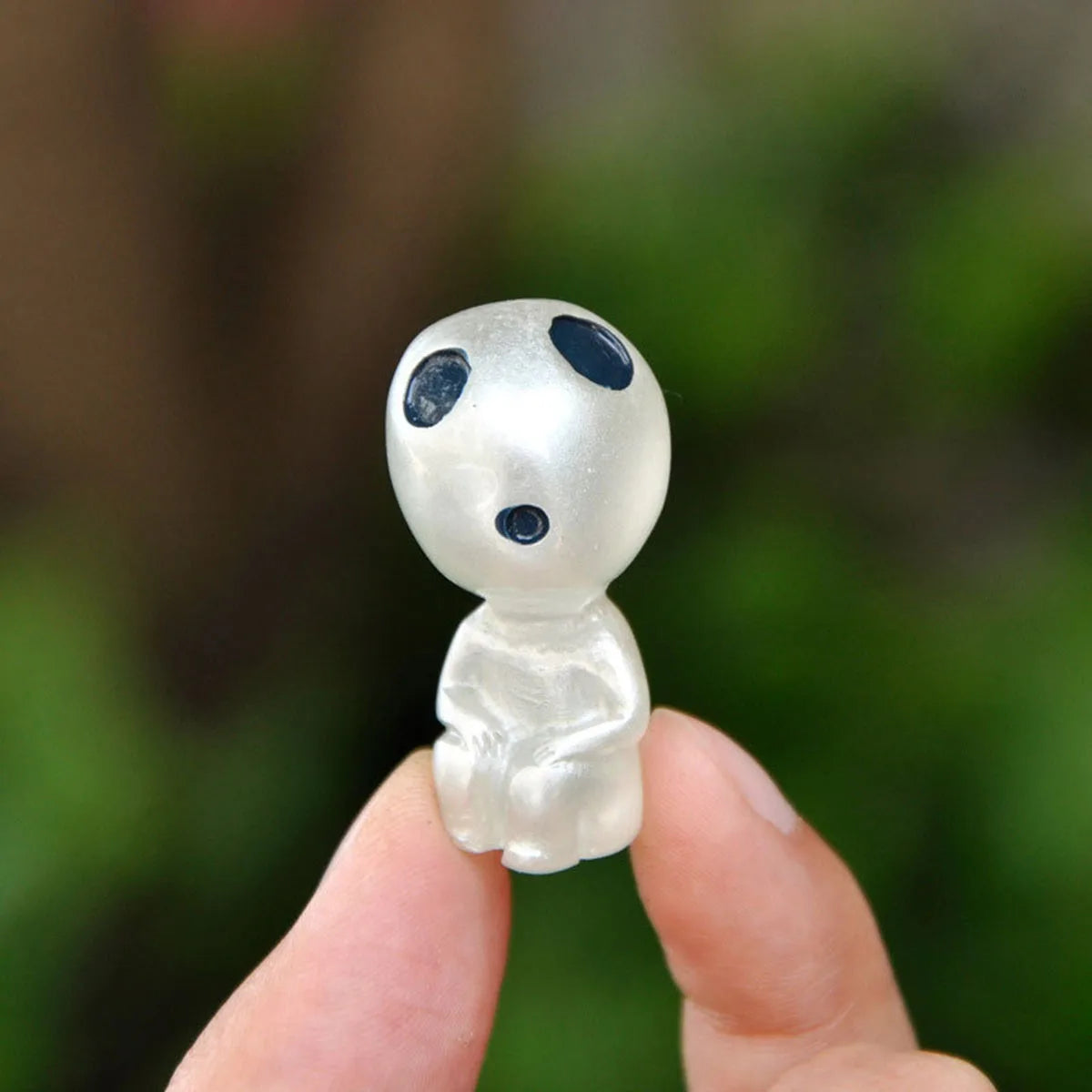 Glow-in-the-dark miniature garden figure ornament, white with blue eye spots