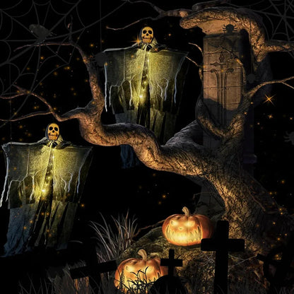 Glowing skeleton gauze hanging ghost set with illuminated skull faces