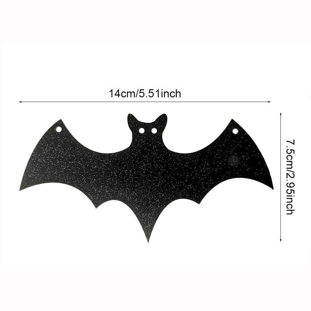 Black glitter-style bat cutout banner piece with two bat shapes