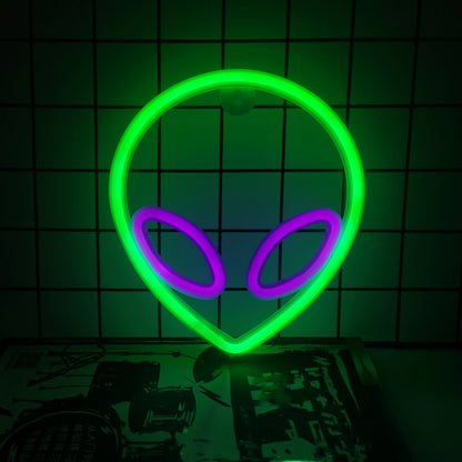 LED neon wall decor with green alien head and purple eyes