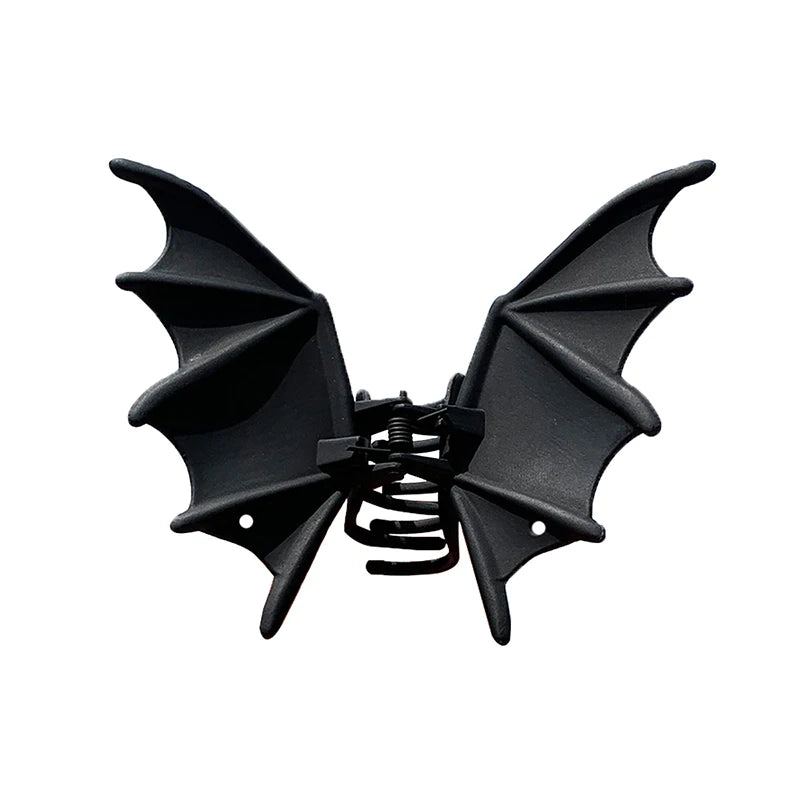 Black bat hair clip with pointed wings and spring clasp, front view