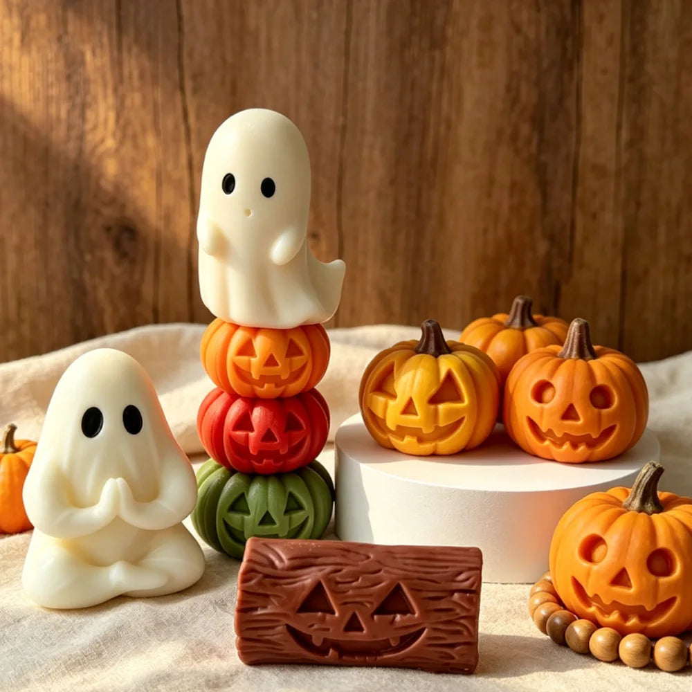 White ghost candle with stacked jack-o’-lantern candles in orange and green