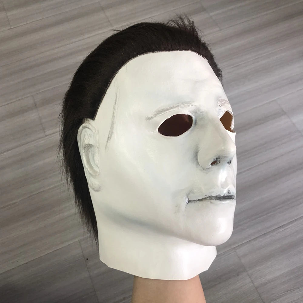Michael Myers-style Halloween mask with white face, dark hair, and mouth detail