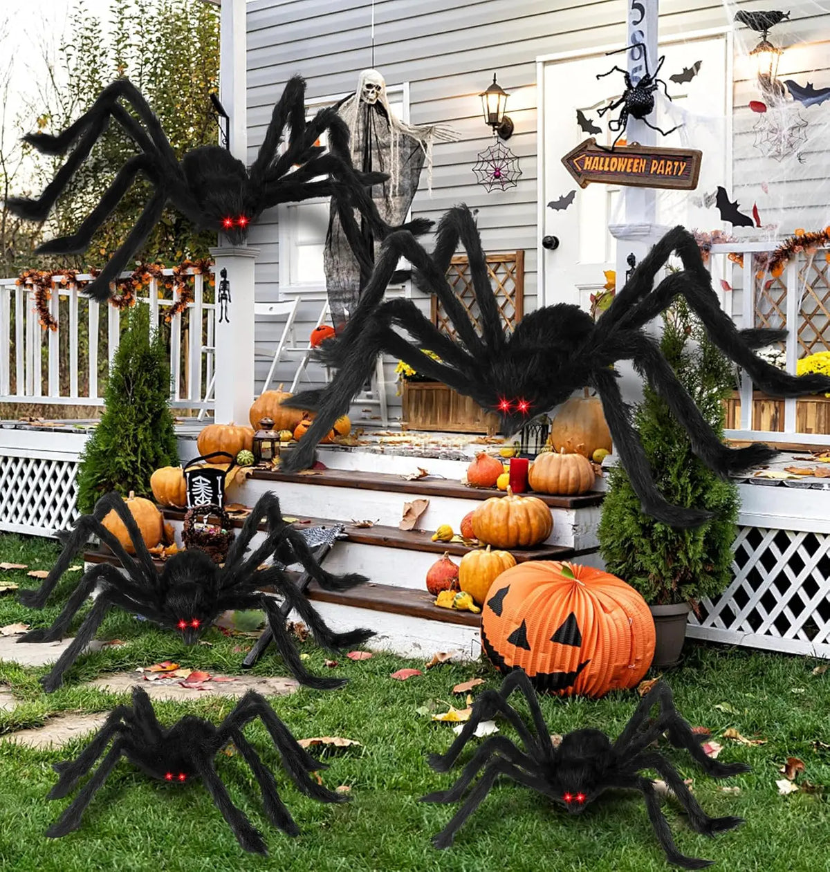 Giant plush black spider decoration with long fuzzy legs and glowing red eyes