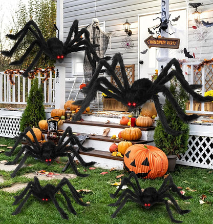 Giant plush black spider decoration with long fuzzy legs and glowing red eyes