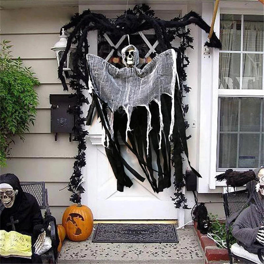 Hanging skull prop on outdoor display, gray sheet with skull head and black skeletal hands