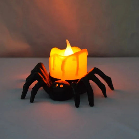 Halloween LED ghost candle light with black spider base and warm glow