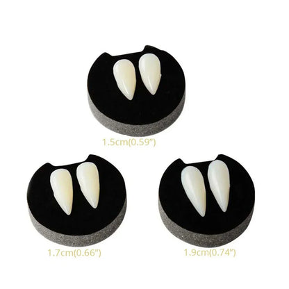 Vampire fang dentures with two ivory fangs on black gum pieces, three size options