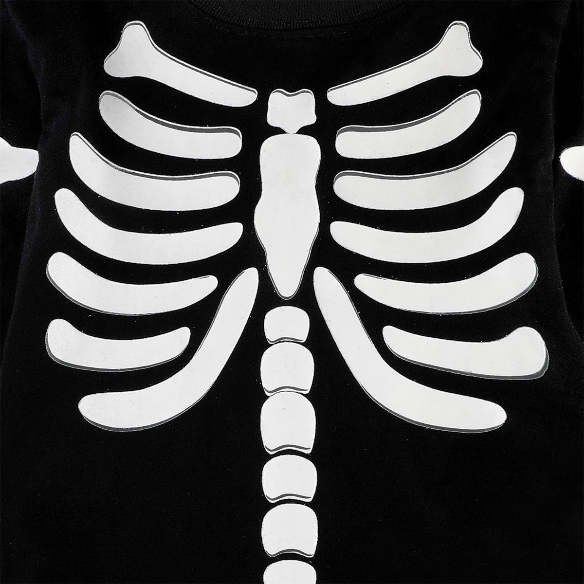 Black long-sleeve shirt with white skeleton ribcage and spine print, chest view