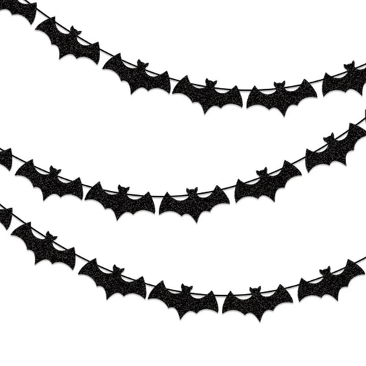 Black paper bat garland with repeating bat cutouts along a curved banner