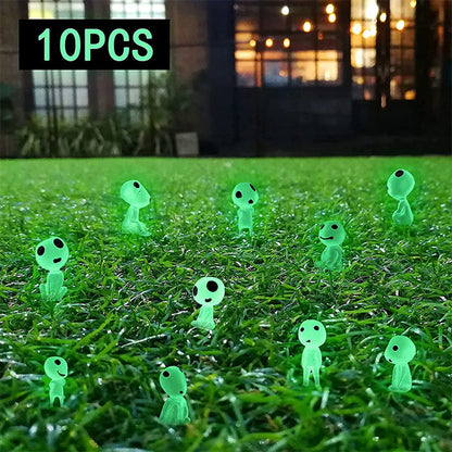 10 green glow-in-the-dark miniature garden ornaments scattered on grass