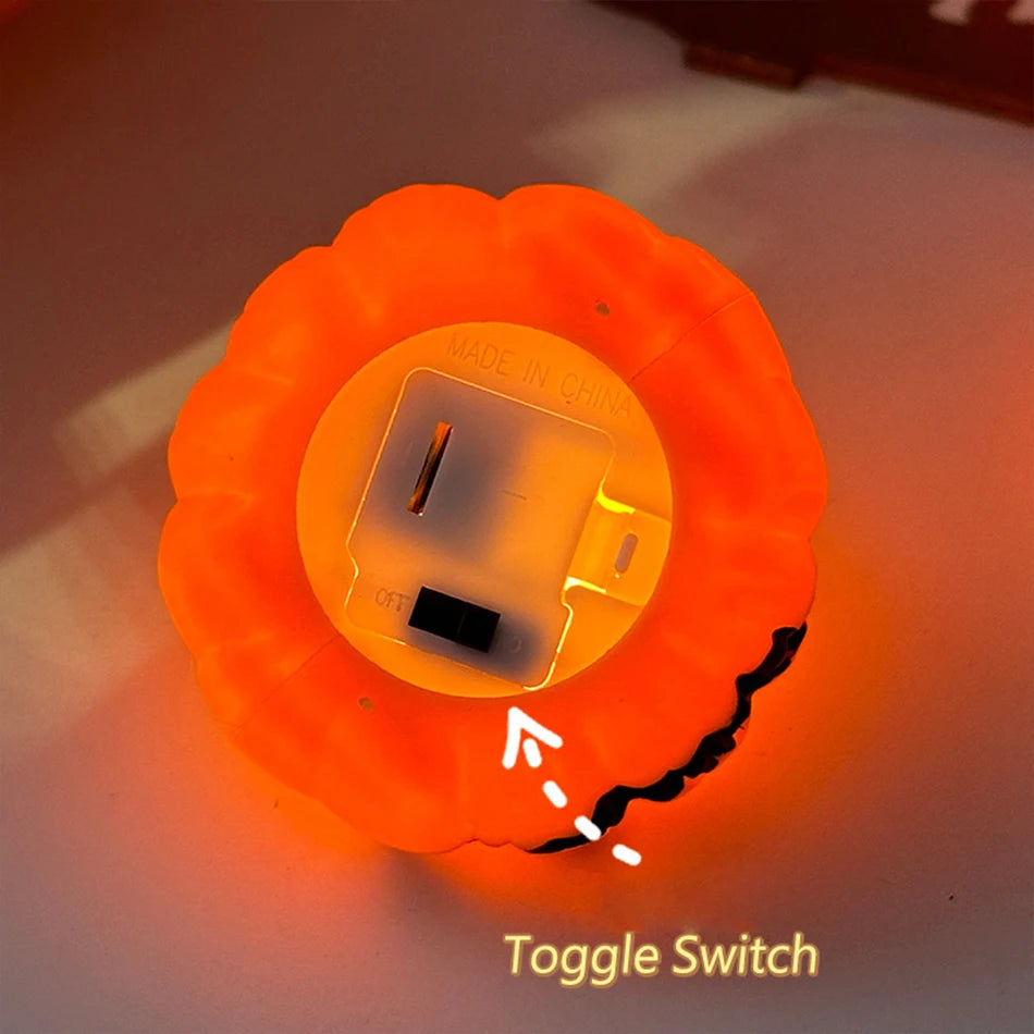 Orange LED pumpkin candle light with carved face and on/off toggle switch