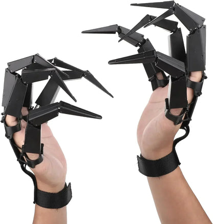 Articulated skeleton finger claw props on hands with black spiked finger pieces and wrist straps