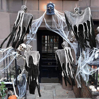 Hanging skull Halloween prop cluster with gray ghost sheet and draped skeleton hands