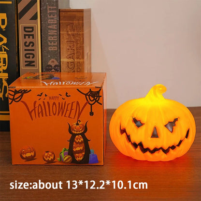 Orange glowing LED pumpkin candle light with jack-o’-lantern cutout face