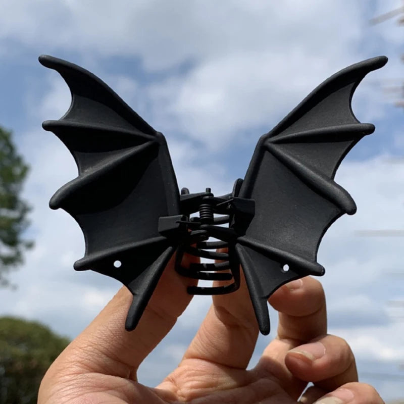 Black bat hair clip with spring clasp and pointed wings detail
