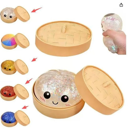 Beige glitter dumpling squishy stress toy in open tan case with cute face
