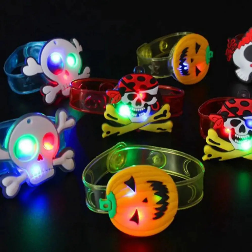 Glow-in-the-dark Halloween character bracelets and rings with skull, ghost, and pumpkin lights
