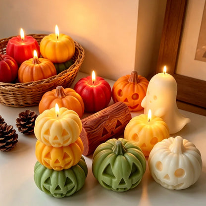 Stacked pumpkin and ghost Halloween candle figures in orange, green, and white