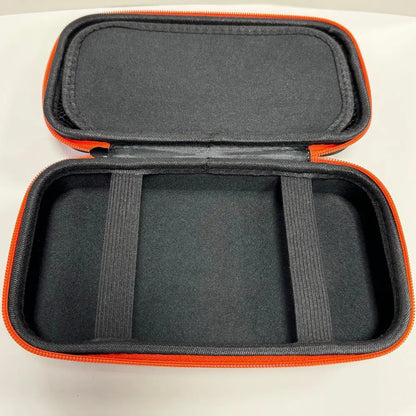Open black hard travel case with orange trim, padded divider slots inside