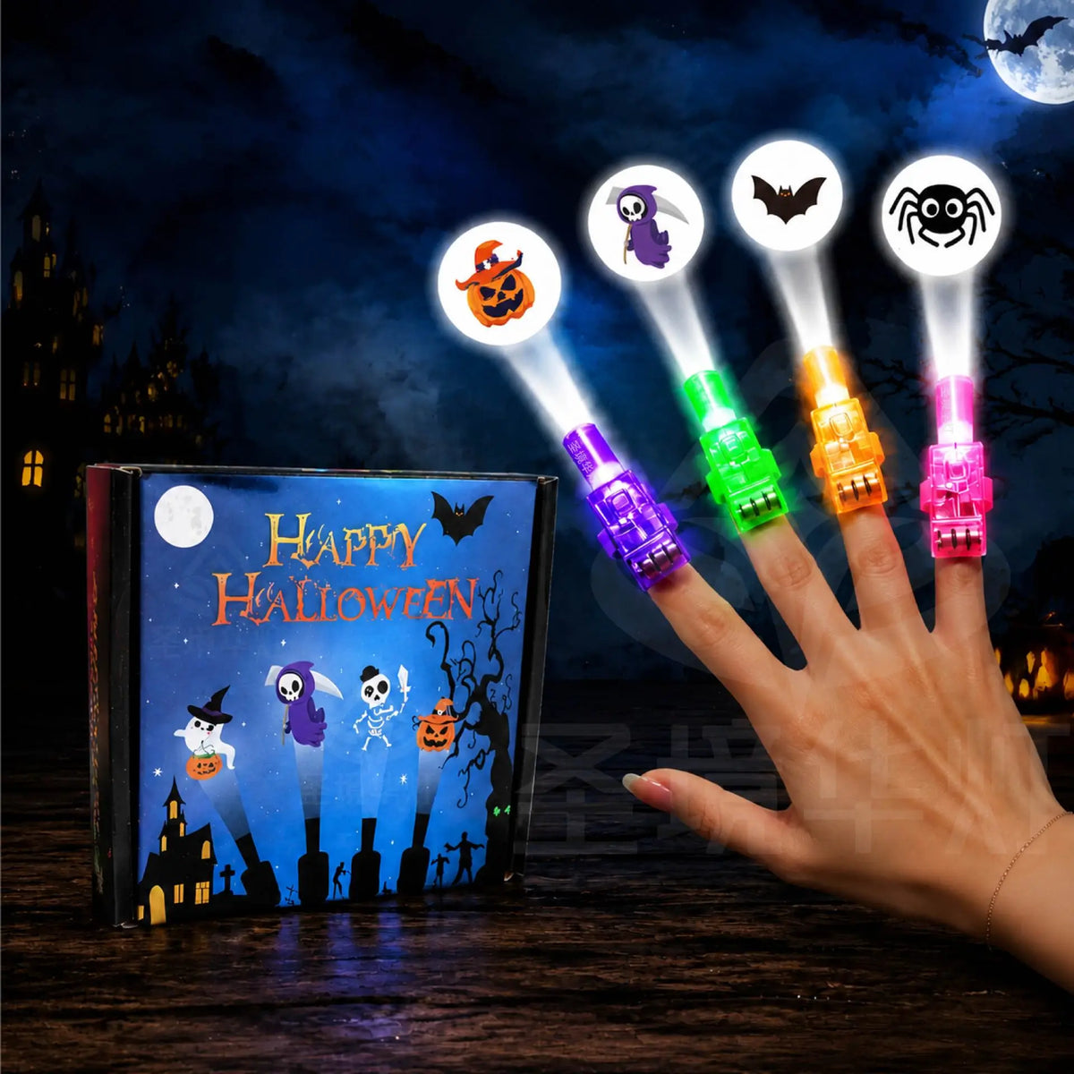 Halloween LED finger projector lights held in hand beside a Happy Halloween gift box