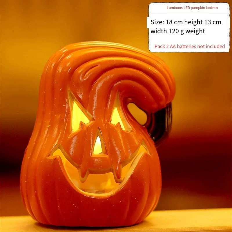 Orange LED pumpkin lantern showing curved jack-o'-lantern face, warm light glowing