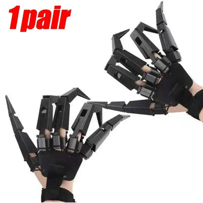 One pair of black articulated finger claw props showing two hands with long pointed claws