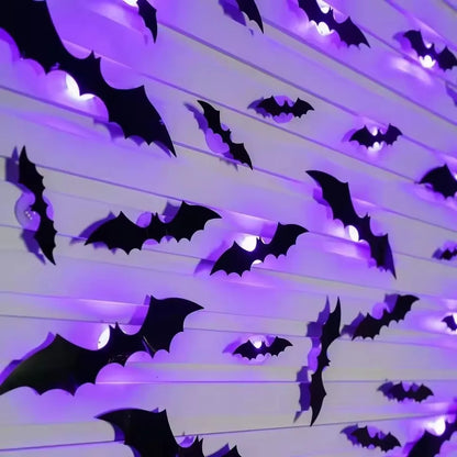 Black bat wall decals with purple LED glow, angled view on light strips