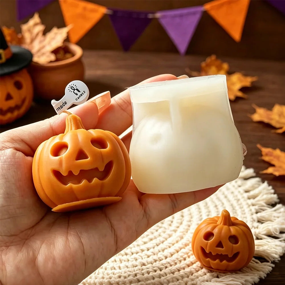 Orange jack-o’-lantern candle next to white silicone mold cavity held in hand