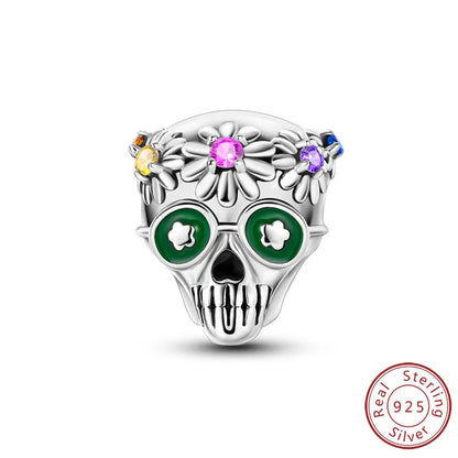 925 sterling silver skull charm bead with green enamel eyes and pink purple gem